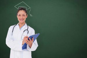 Composite image of happy doctor writing on clipboard